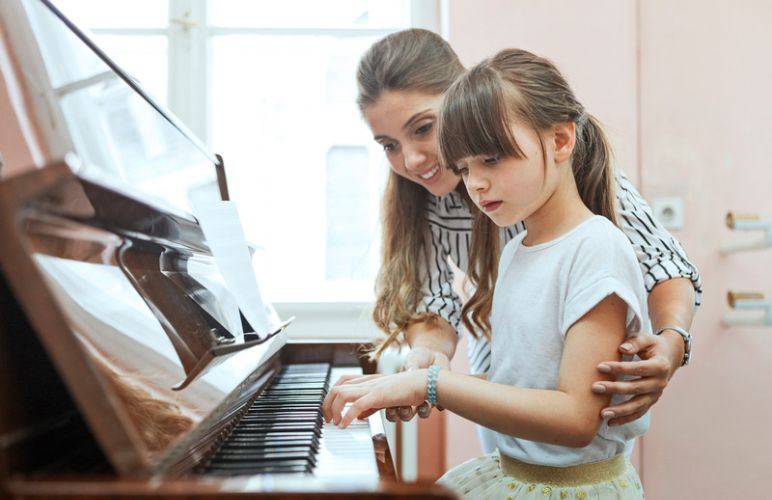 Piano Teacher with Student