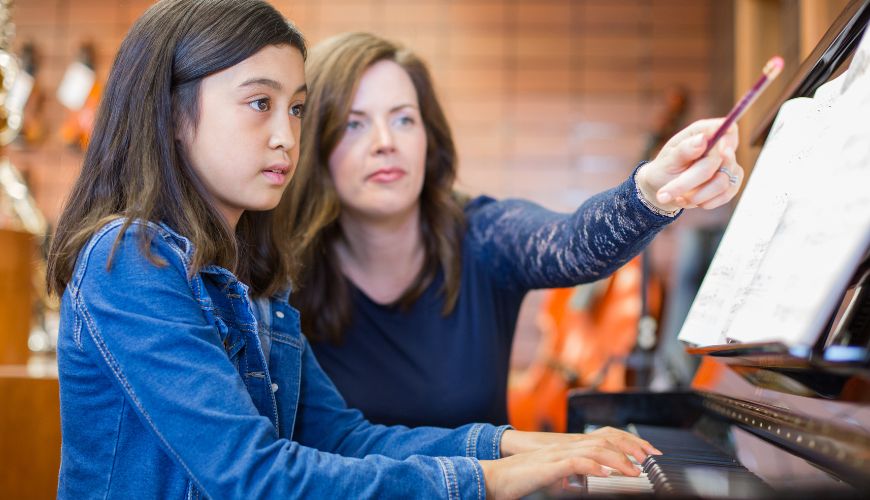 Piano Teacher taking Piano Lesson